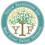 A logo for yellow farmhouse inn in mad river valley vermont
