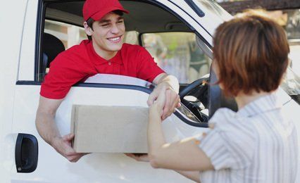 courier delivery specialist wearing a red coloured cap