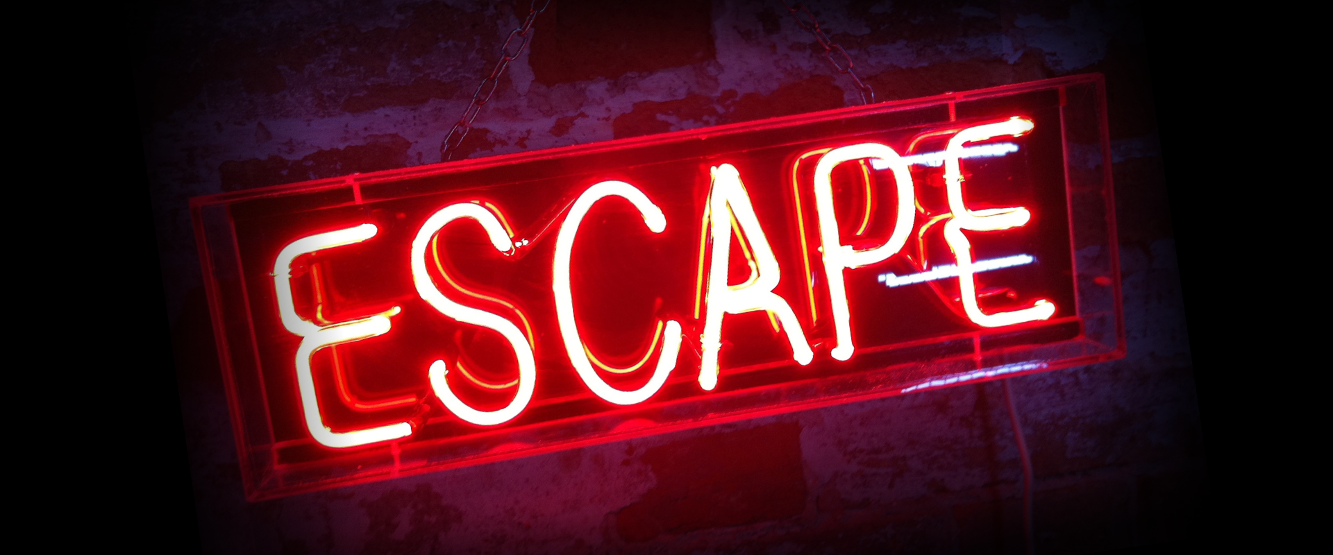 A neon sign that says escape on it