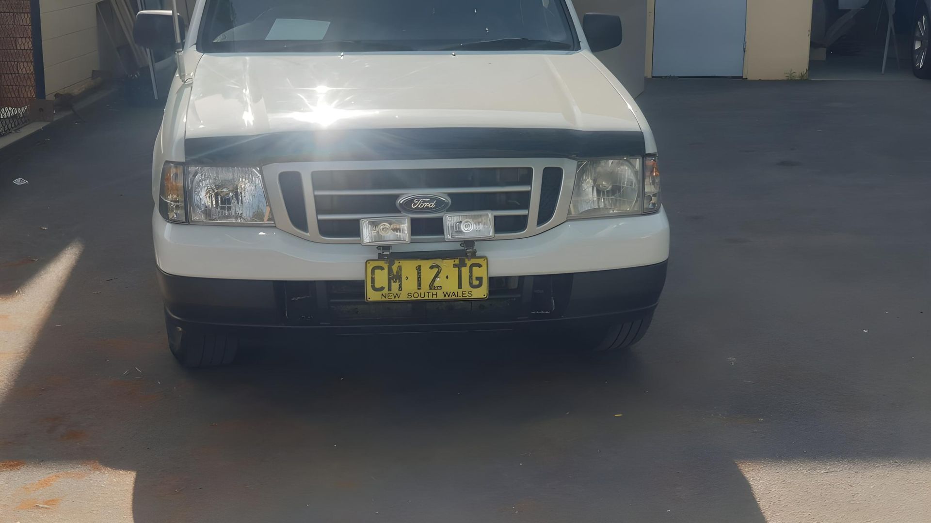 A White Ford Ranger Truck is Parked in a Parking Lot — M & D Shipp Smash Repairs In Dubbo, NSW