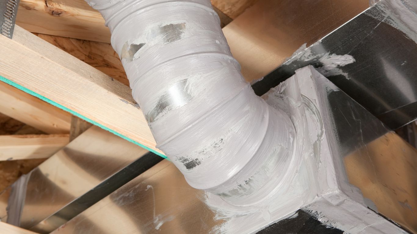 TSC-HVAC - A close up of a duct in a room with a saw.