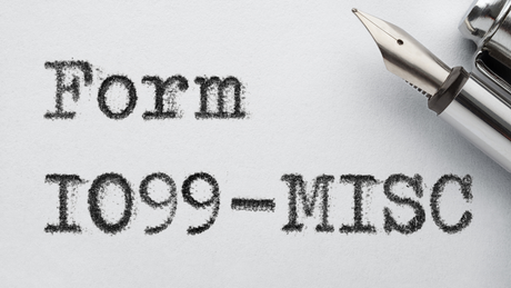 Form 1099-MISC printed on paper with a fountain pen in the top right corner.