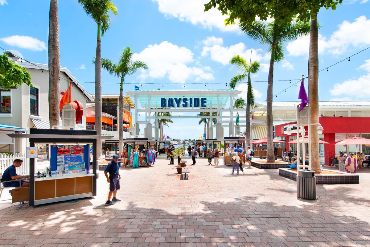 When you enter Bayside Marketplace, pass the Bayside sign, walk to the water, make a left, walk to behind Victoria secret and thats were we are located, please make sure to check in at the Bayride window to get your boarding passes. 