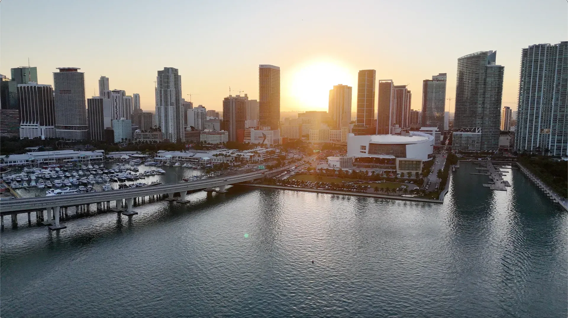 Downtown Miami marina and skyline at golden hour during a sunset cruise Miami.
