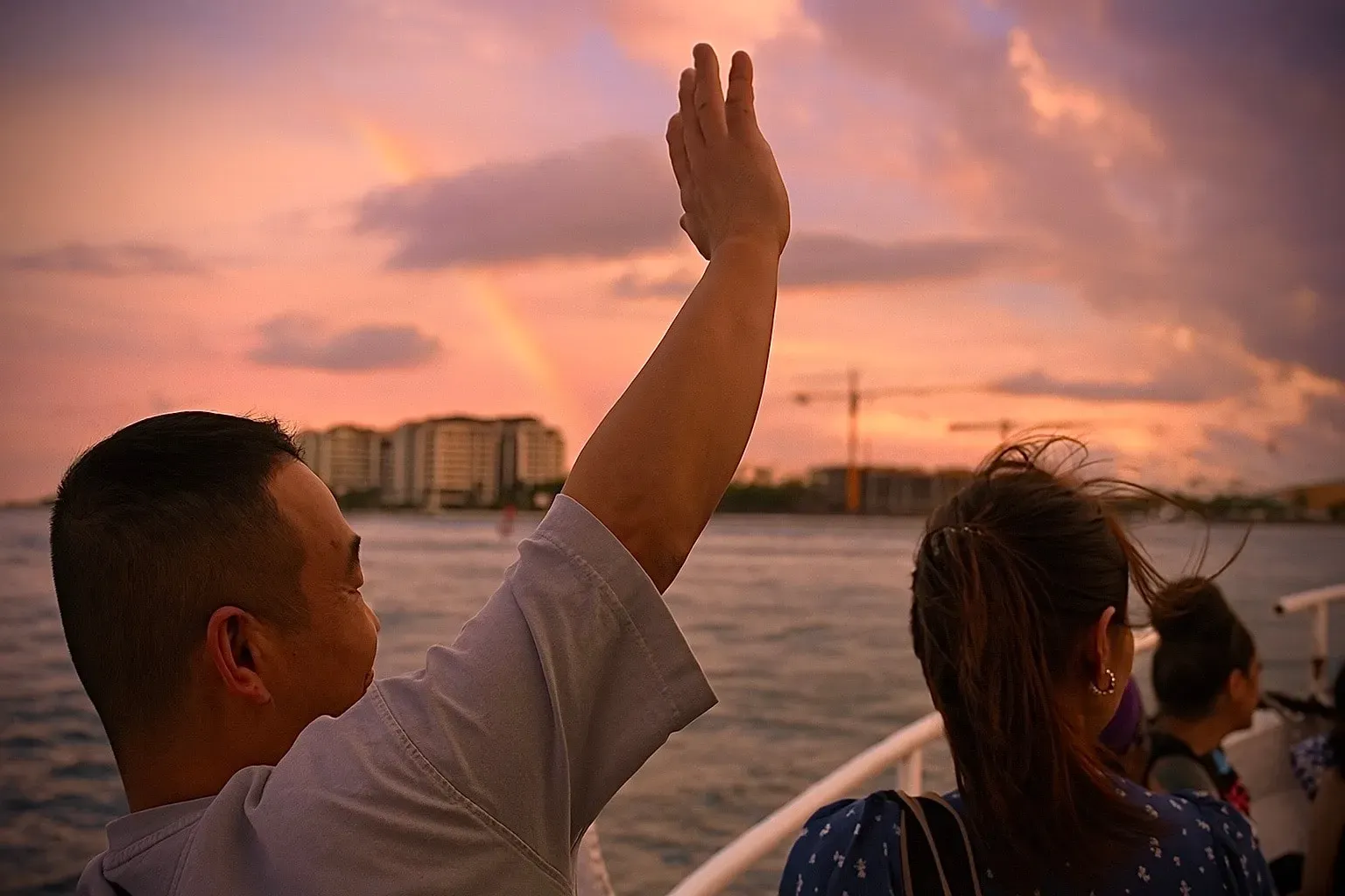 Guests enjoying a Miami Sunset Cruise with open water views during golden hour.
