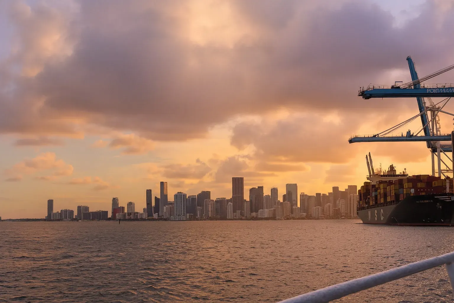 Golden sunset views during a Miami Sunset Cruise seen directly from the boat.
