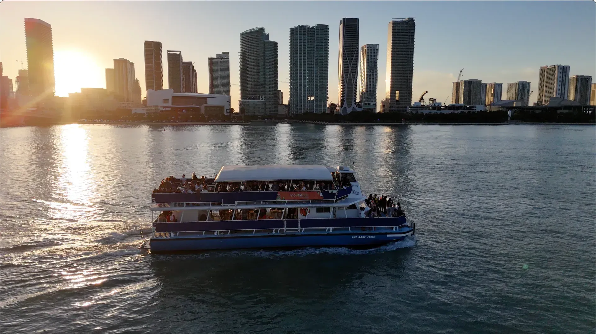 Boat passing downtown during a sunset sightseeing cruise in Miami.