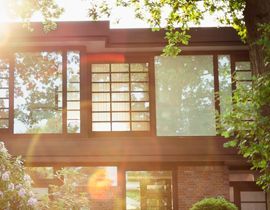 The sun is shining through the windows of a house.