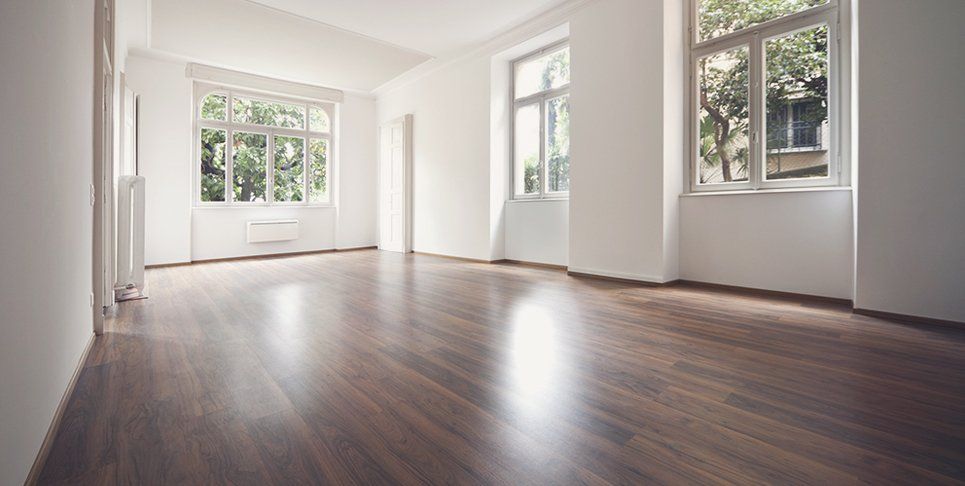An open room with wooden flooring