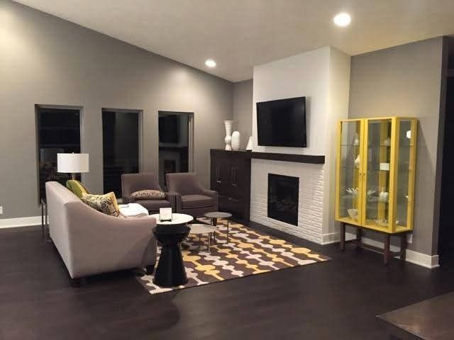 A living room filled with furniture and a fireplace