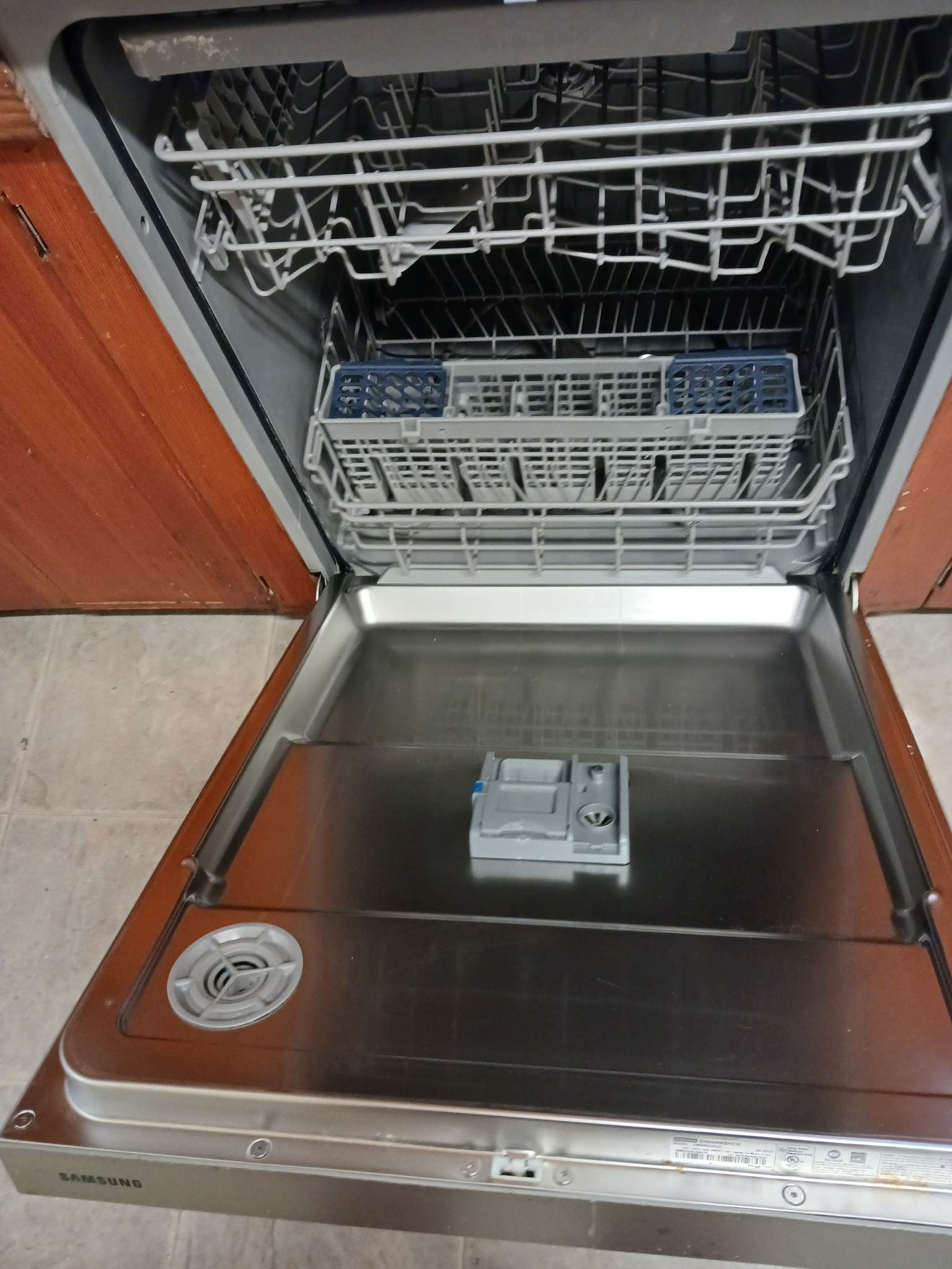 A stainless steel dishwasher with the door open