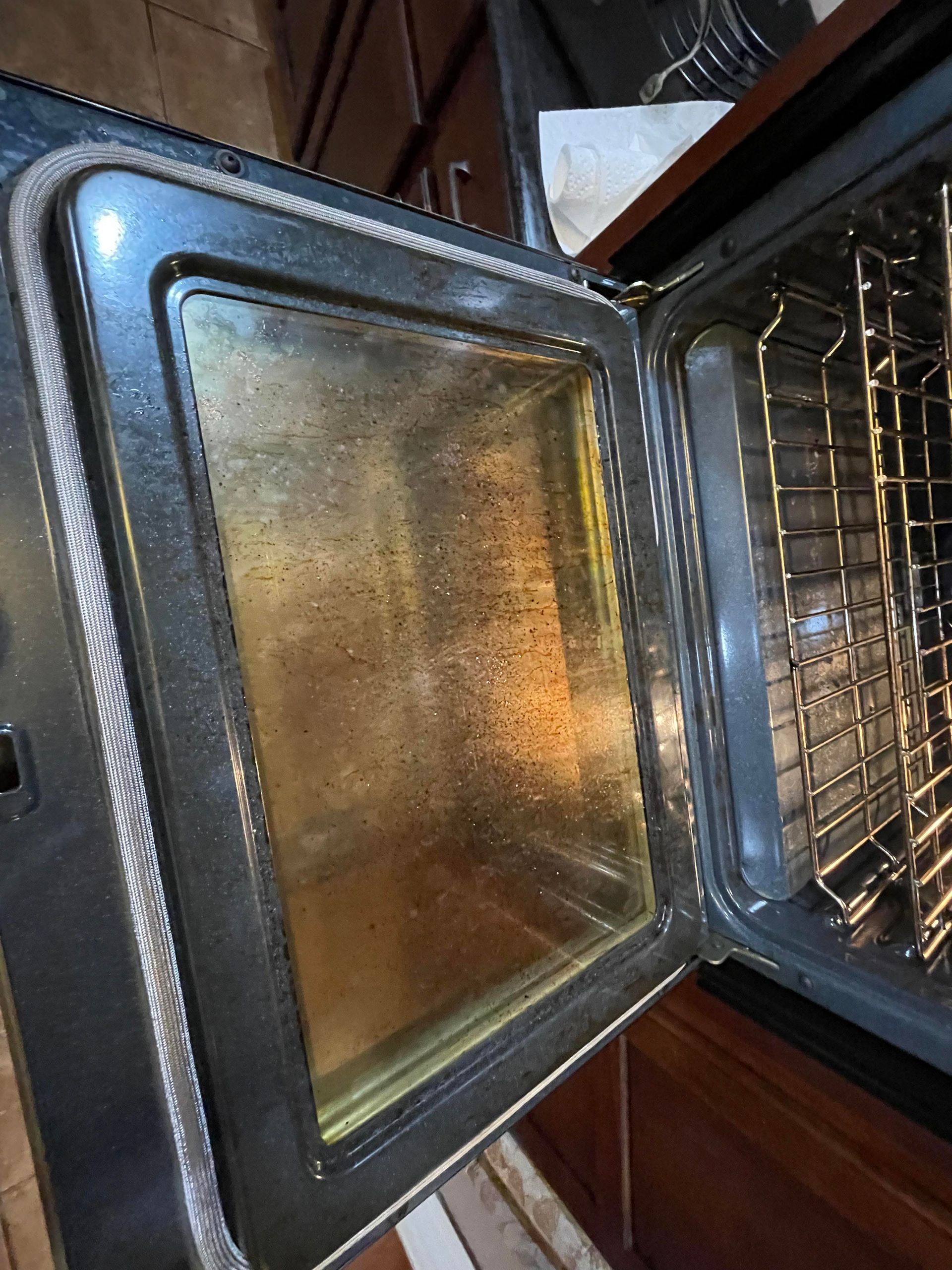 A close up of the inside of an oven with the door open.