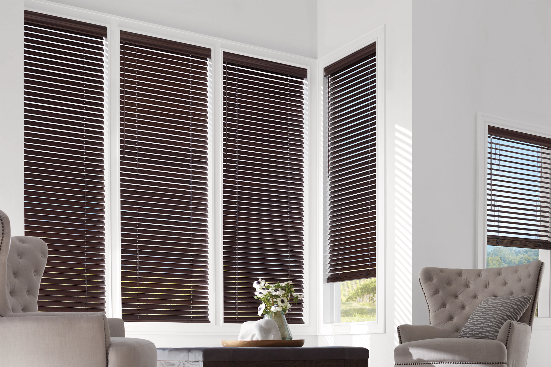 Hunter Douglas automated blinds in dark wood at the window in a cozy living room