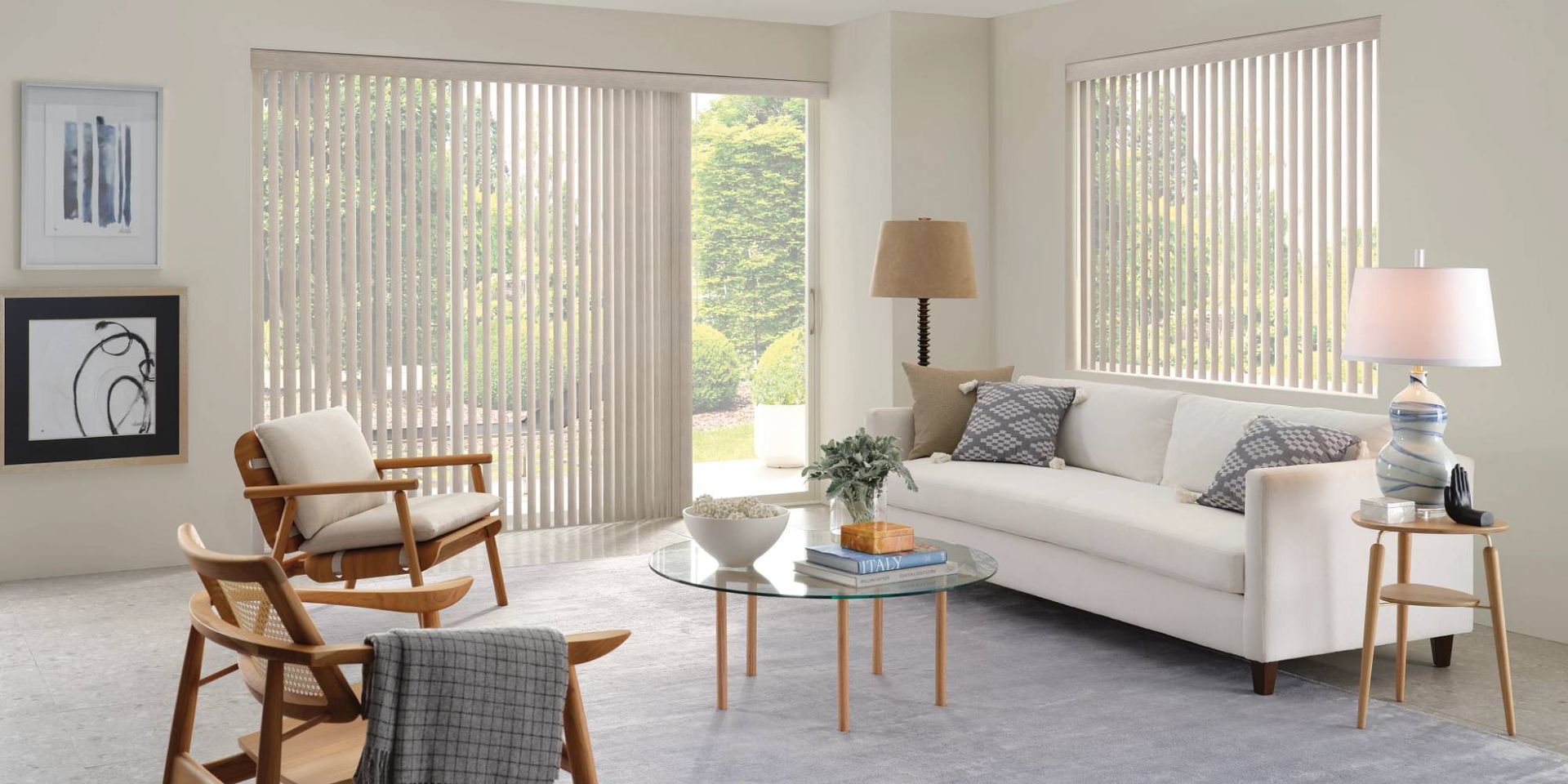 Hunter Douglas Somner® Vertical Blinds on a sliding door and large window in a living room