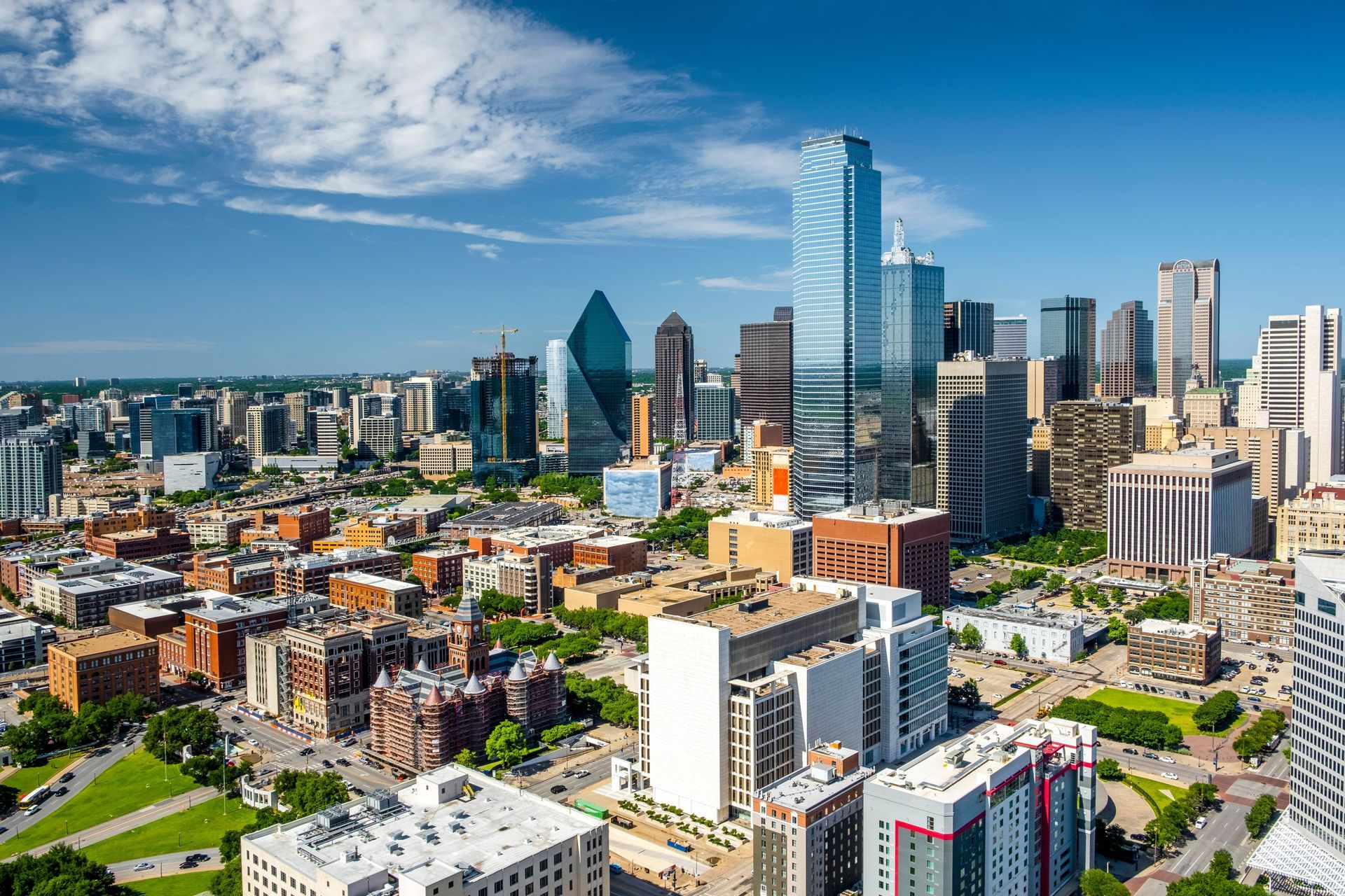 An aerial view of the Dallas skyline on a bright, sunny day with bright blue skies near Prosper, TX