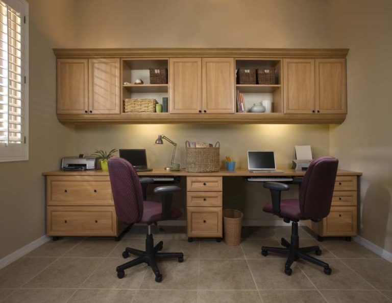 A home office with two desks and two chairs