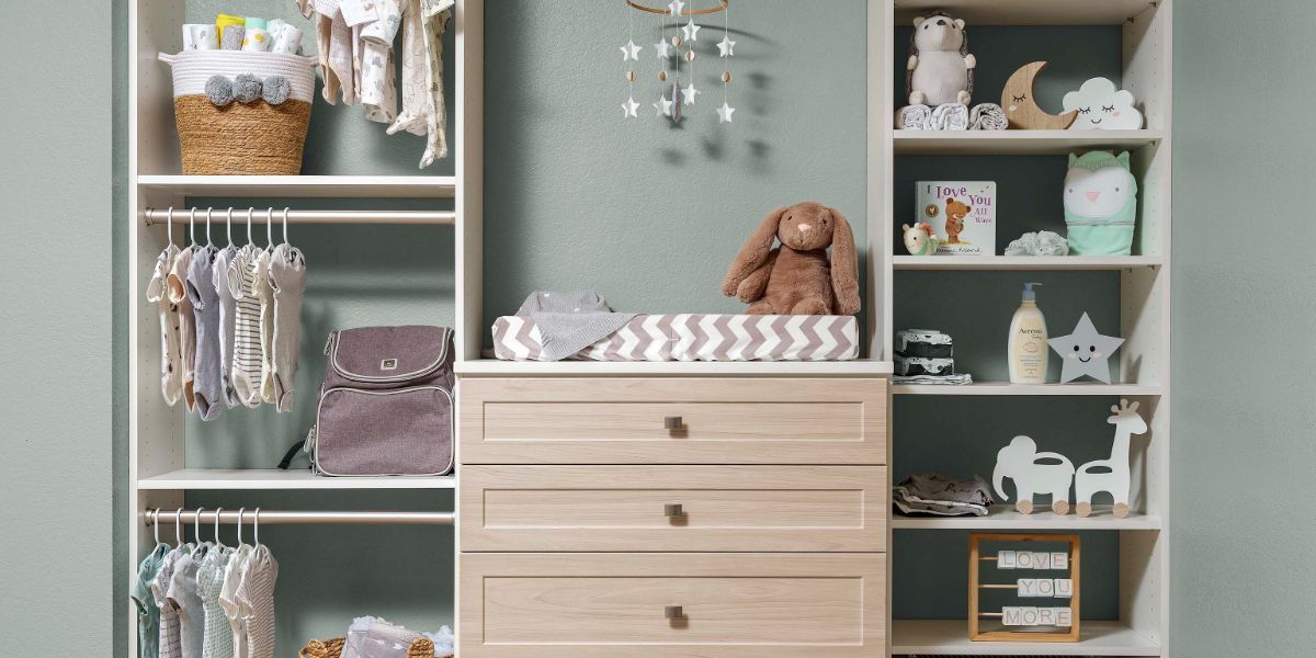 A kids room with a dresser , shelves , and a changing table.