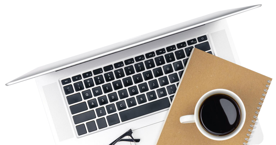 Laptop, coffee cup, and notepad on a white surface, overhead view.