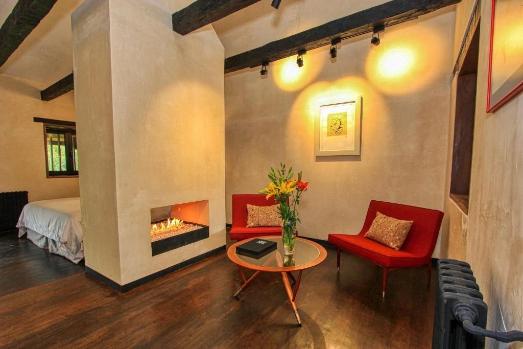 A living room with a fireplace and a couch