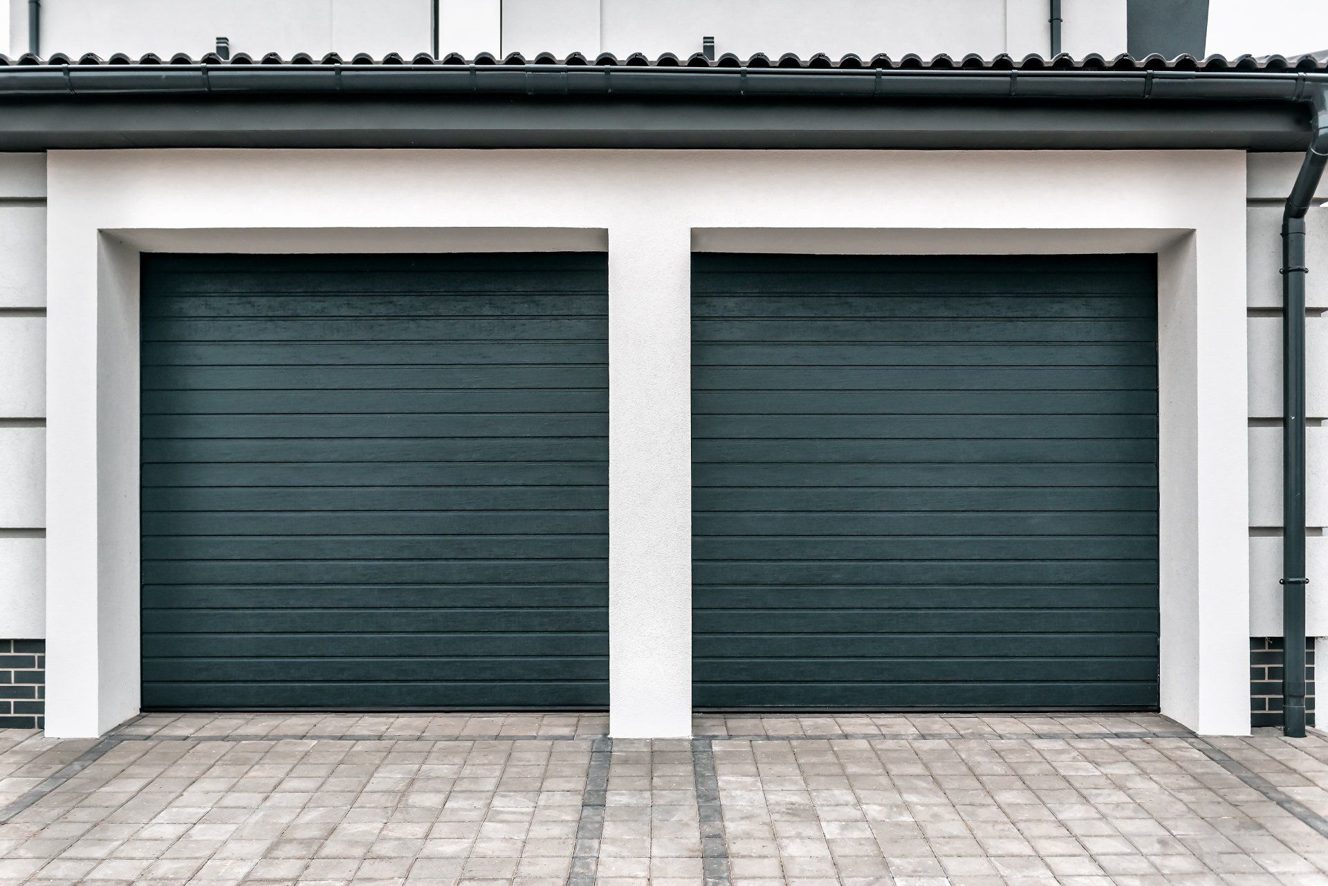 Twin Blue Green Garage Door — House And Driveway in Appleton, WI Twin Blue Green Garage Door — House And Driveway in Appleton, WI