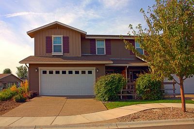 Residential Garage Doors — House And Driveway in Appleton, WI
