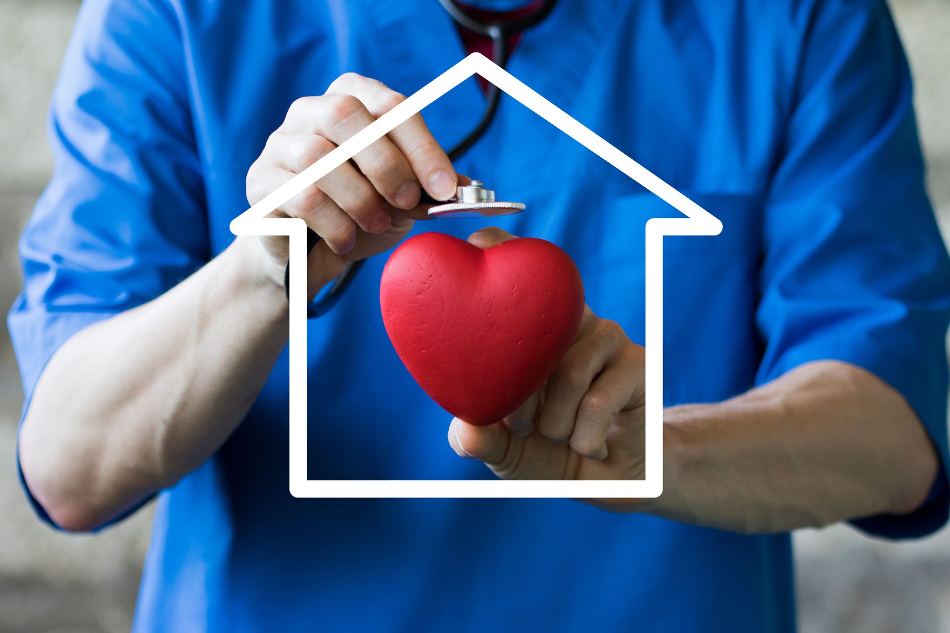 A medical professional in blue scrubs using a stethoscope on a red heart within a house outline.