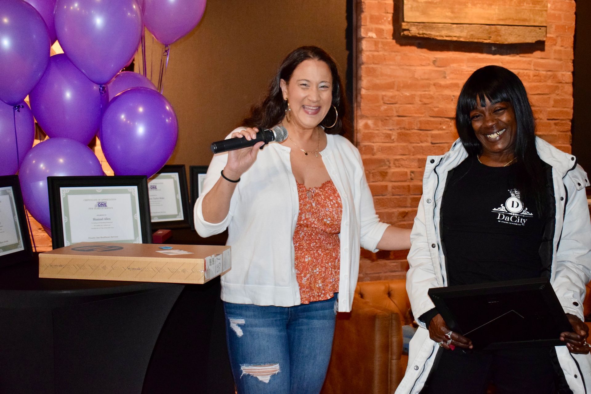 Two Women Are Standing Next to Each Other — Saint Louis, MO — Priority One Healthcare Services