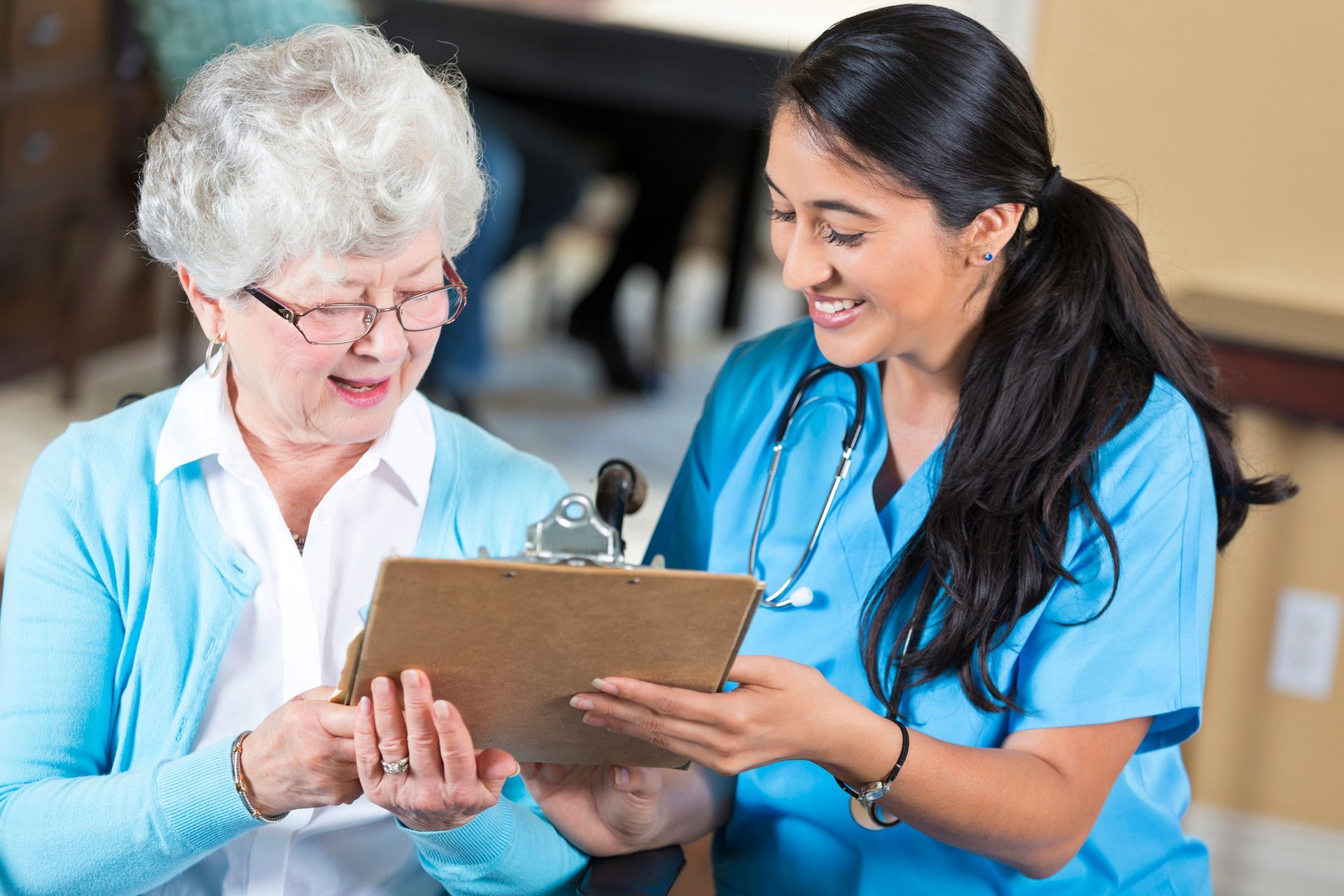 A nurse assists an elderly female patient, showcasing compassionate private duty nursing care.