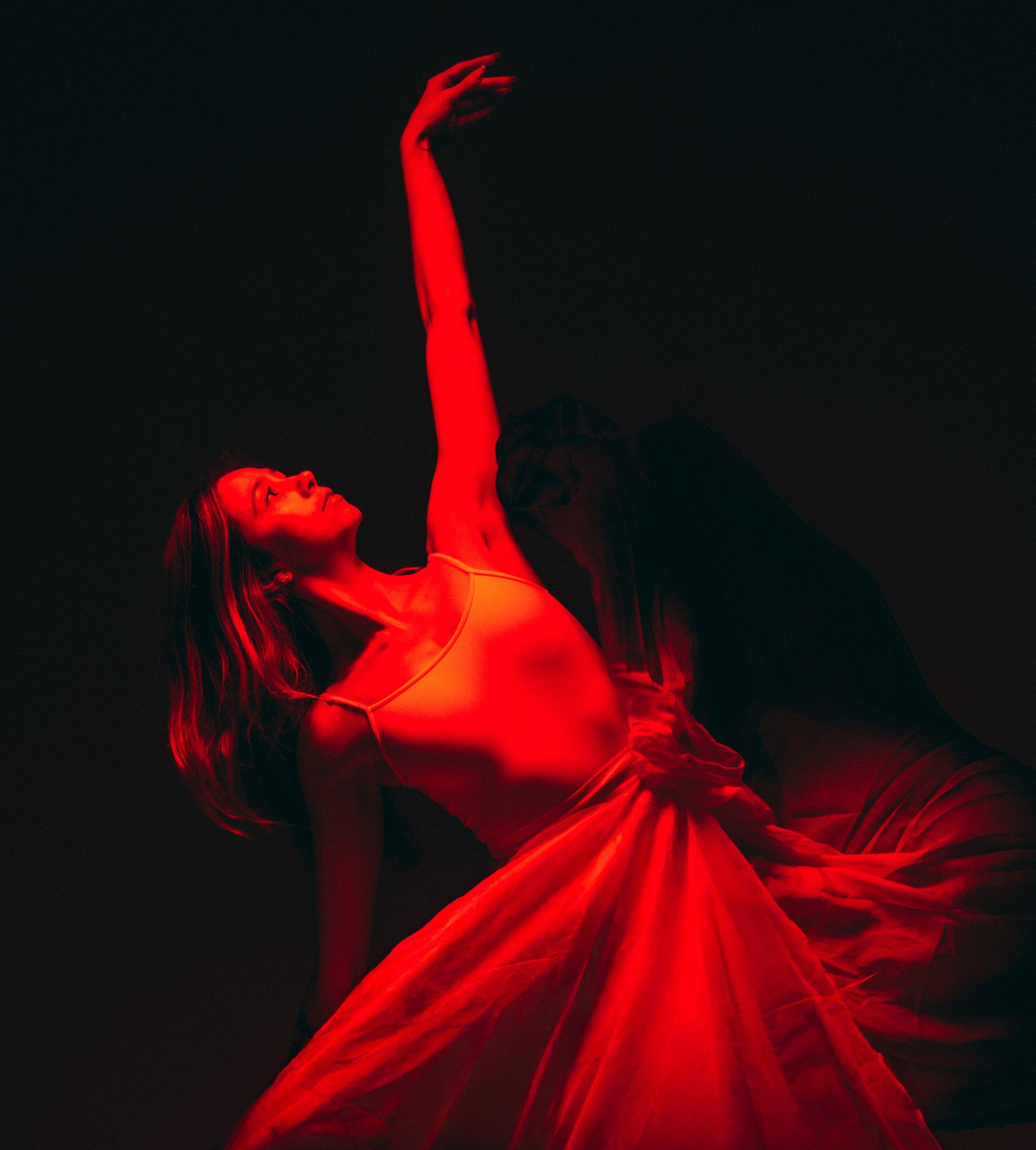 A ballerina is dancing on a stage at YAGP