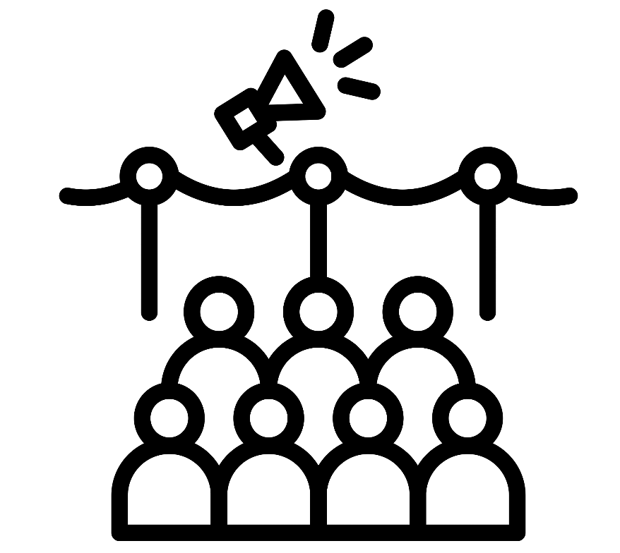 A group of people sitting in front of a stage with a megaphone.