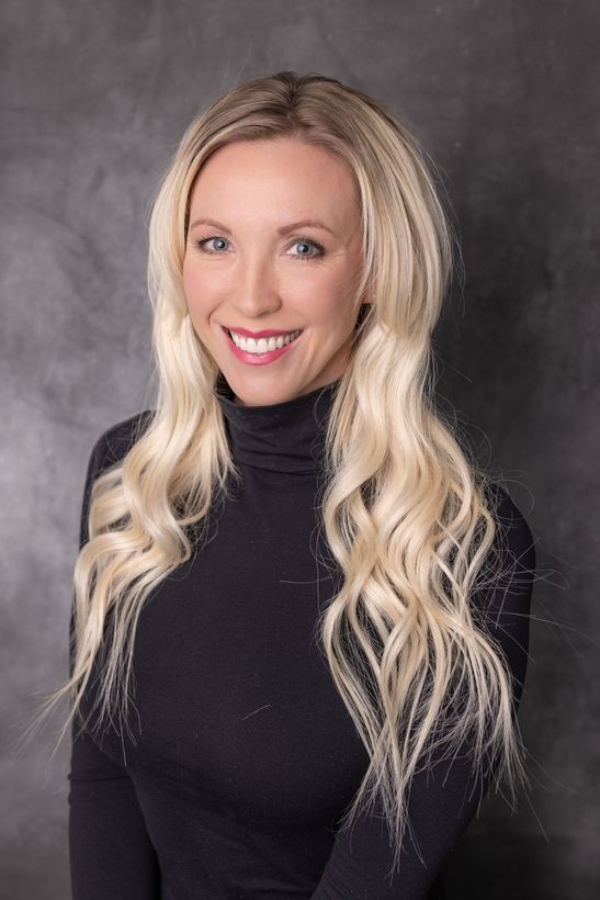 A Real Estate Agent is smiling