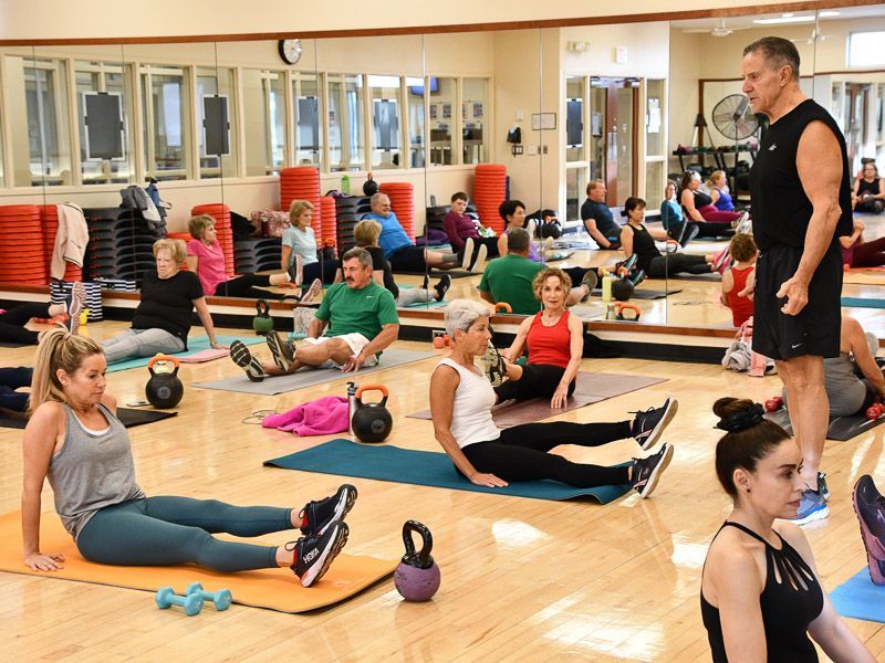 Group Fitness Instructor instructing members in a class