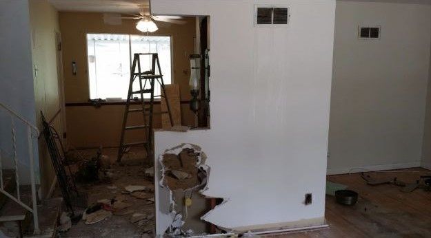 There is a hole in the wall in the middle of the room.