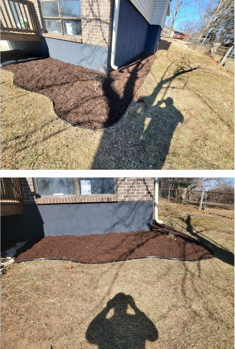 A shadow of a person is cast on the ground in front of a house.