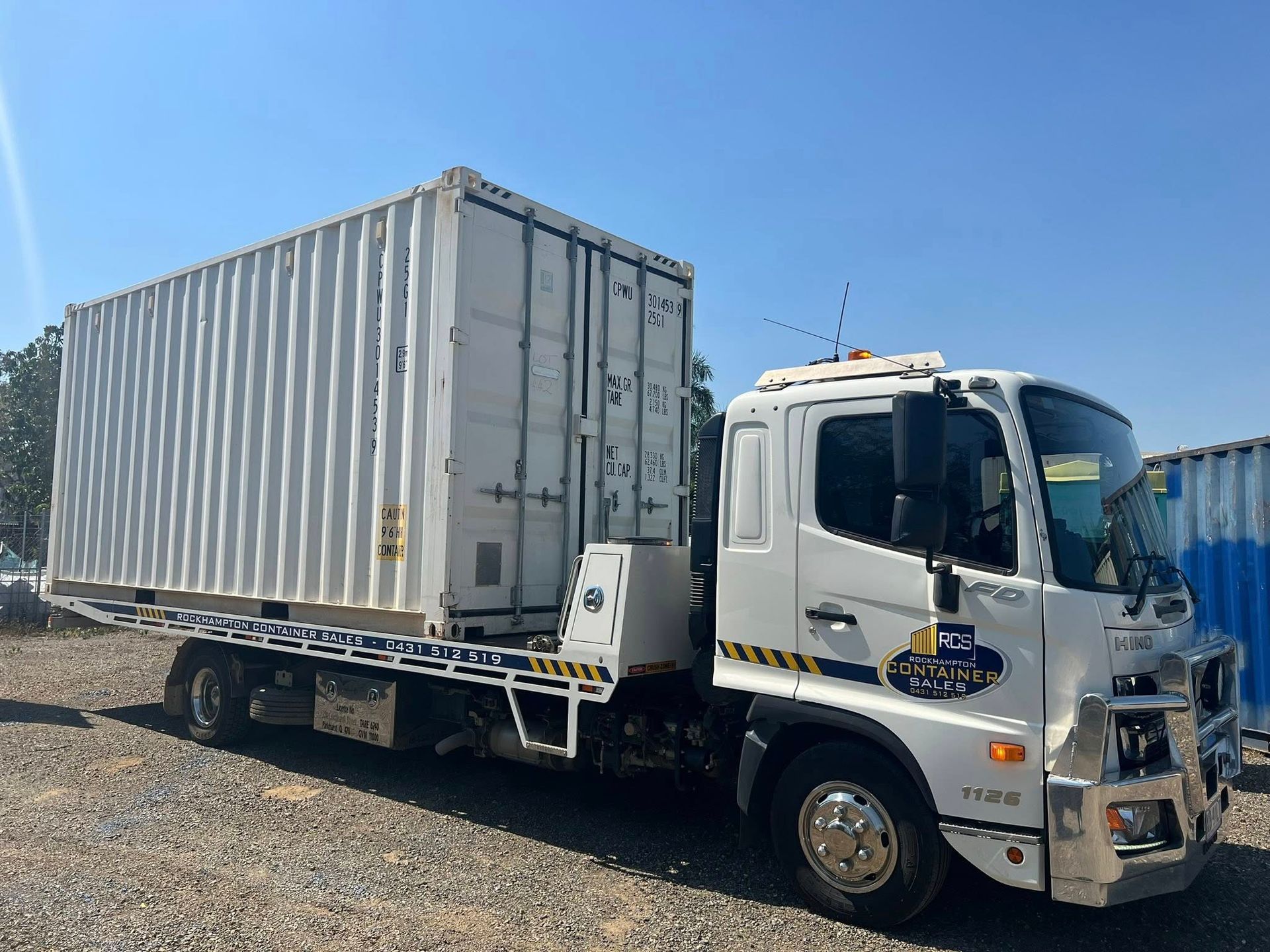 White Truck Carrying a White Shipping Container  — Rockhampton Container Sales in Kawana, QLD
