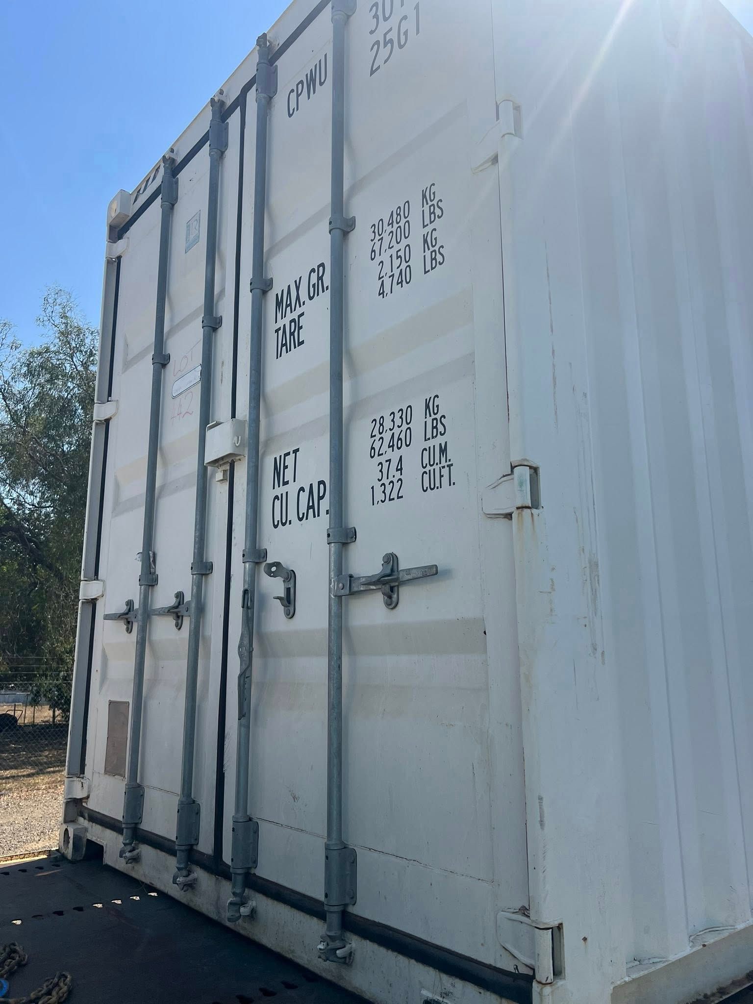 White Shipping Container With Vertical Bars and Markings — Rockhampton Container Sales in Kawana, QLD