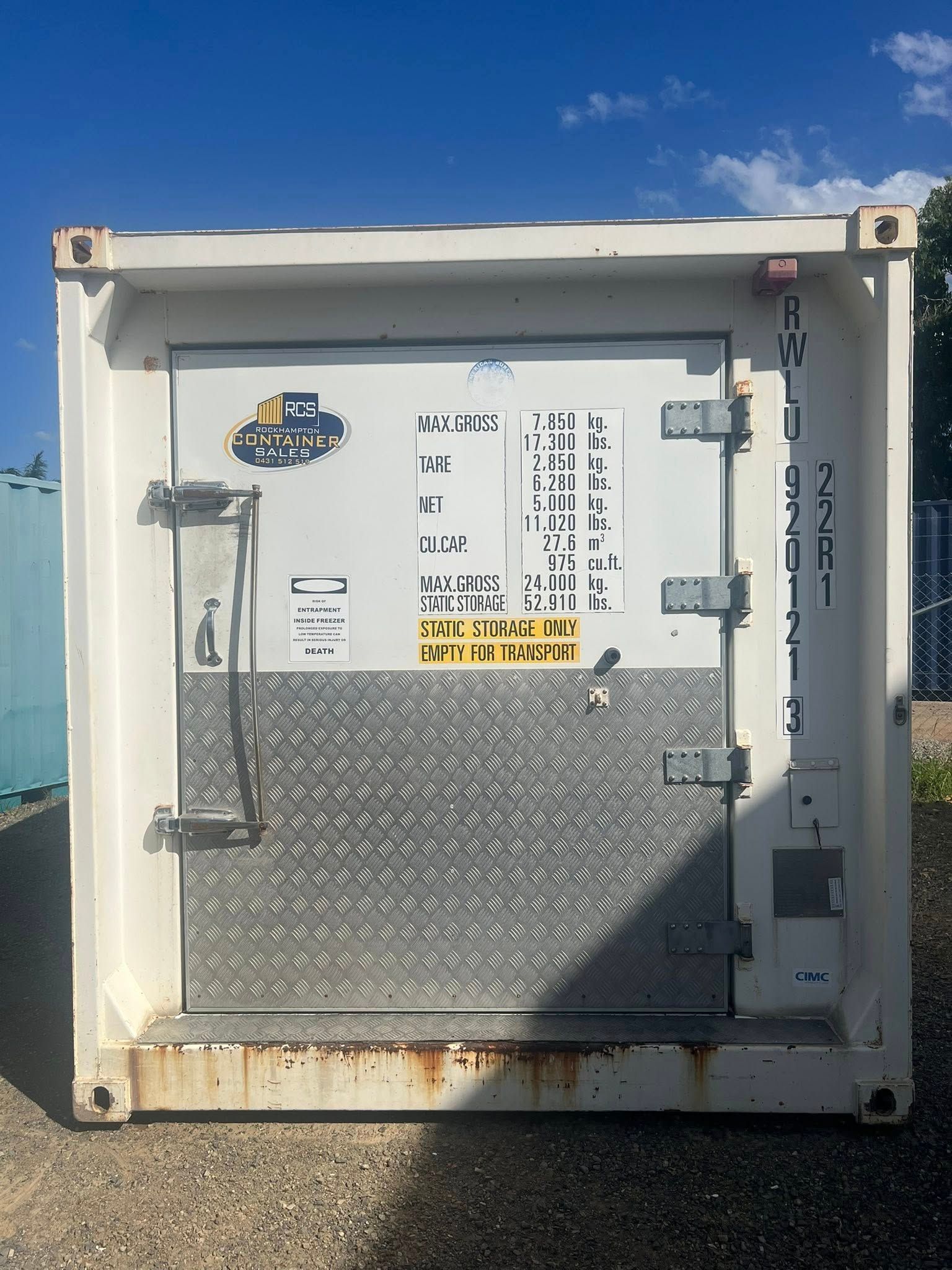 White Shipping Container With Diamond Plate Floor, Door Labels, and Rusty Base  — Rockhampton Container Sales in Kawana, QLD