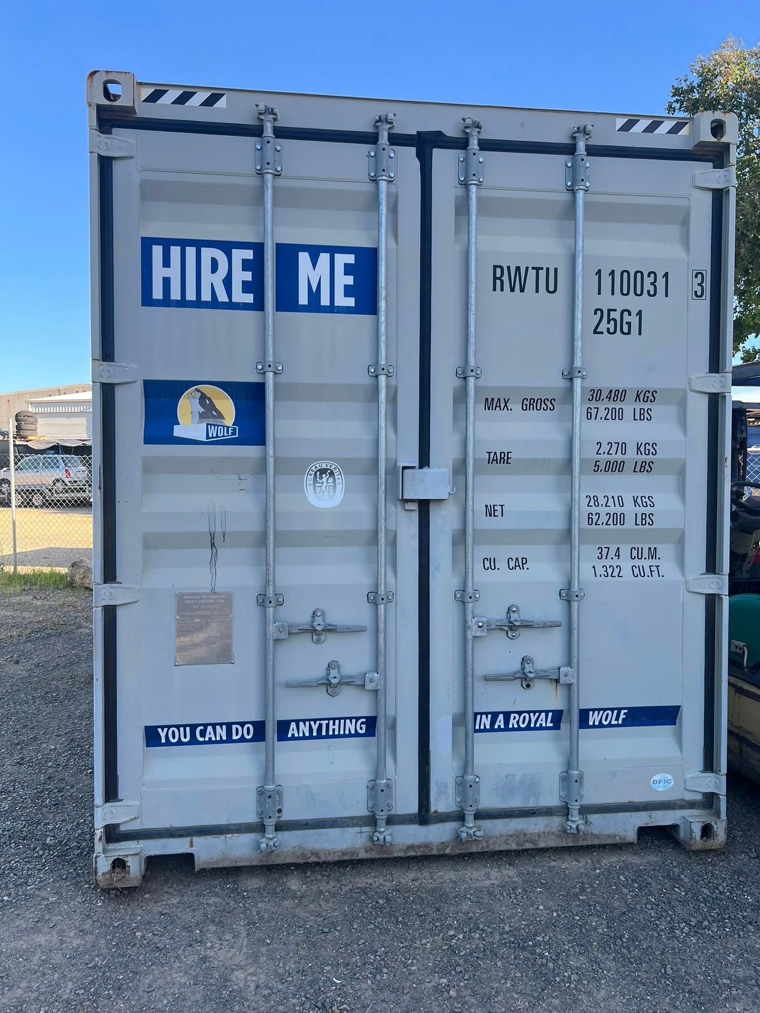 a White Shipping Container With Hire Me in Blue Lettering — Rockhampton Container Sales in Kawana, QLD