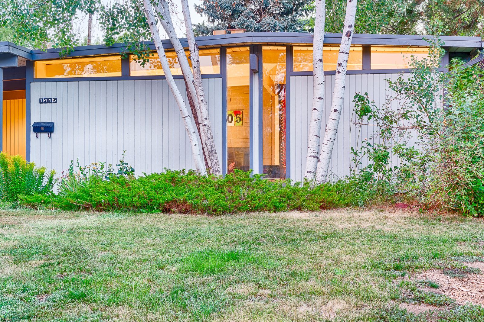 atomic ranch house with aspen trees