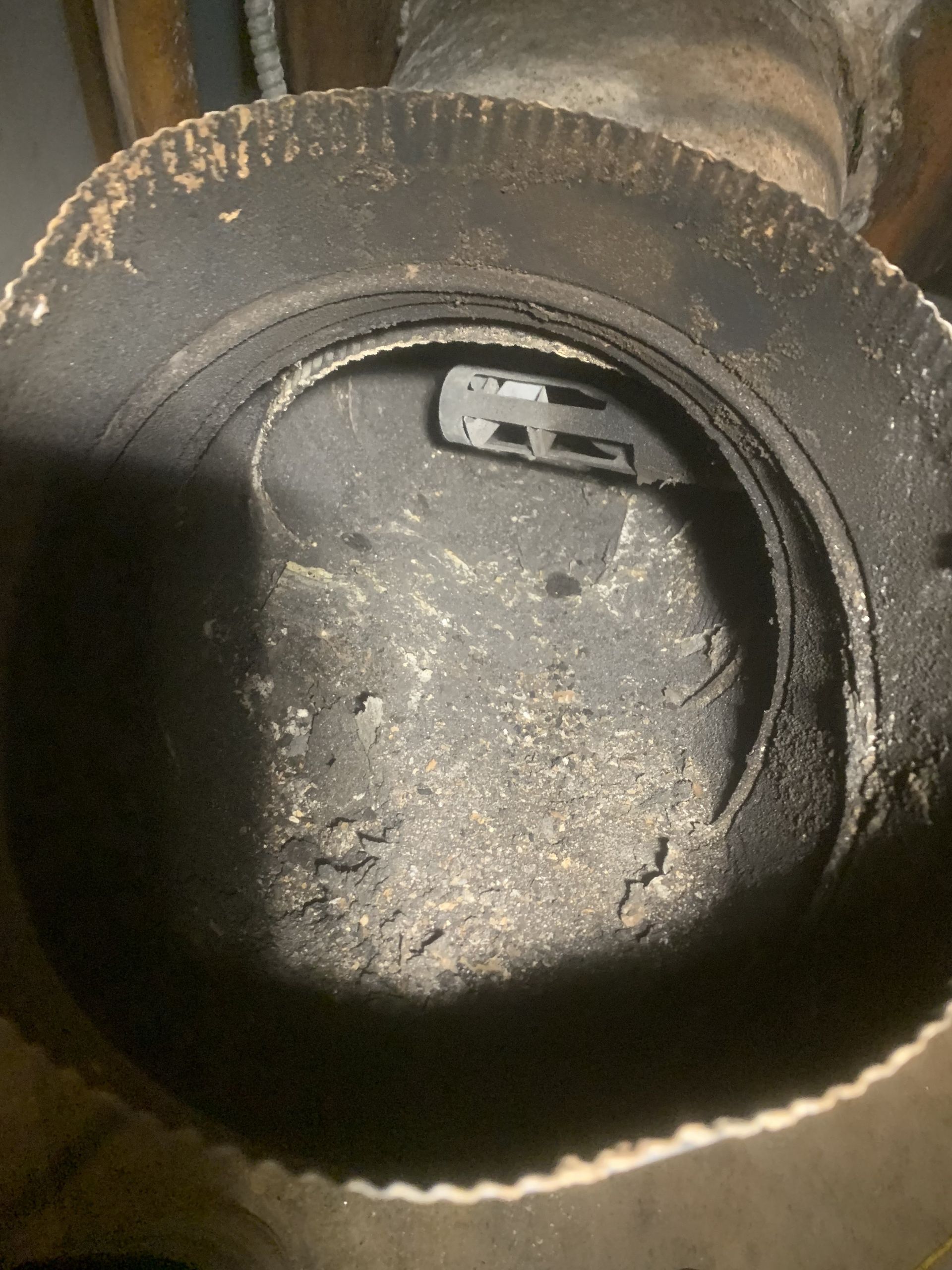 A close up of a tire with a screw in it.