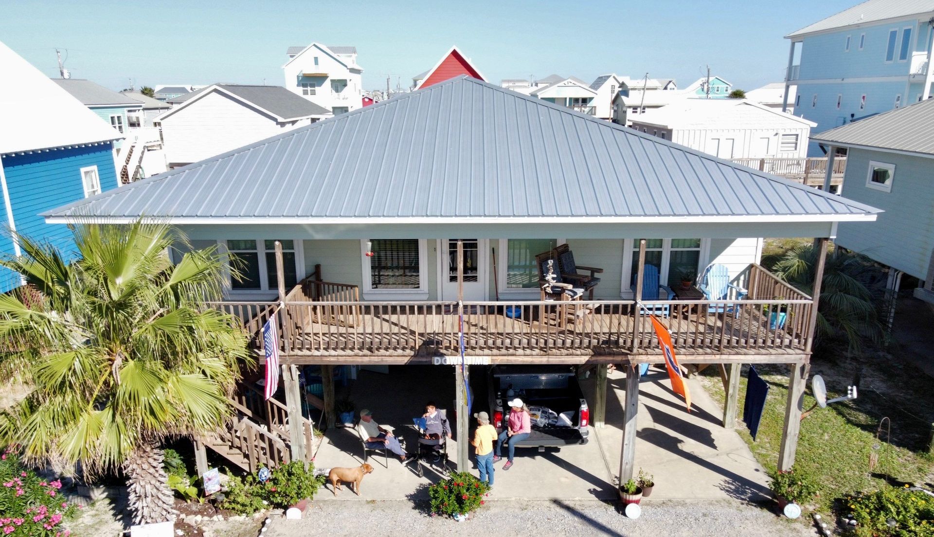 An aerial view of a house with a metal roof