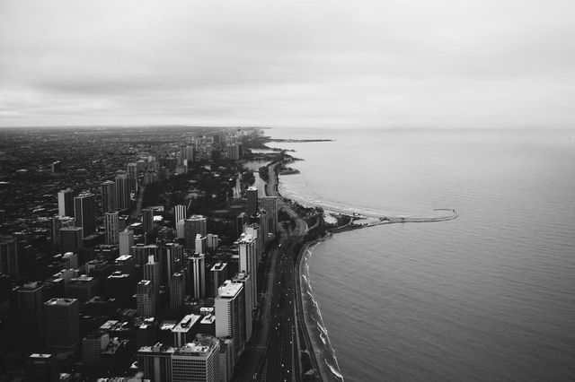 An aerial view of a city next to a body of water.