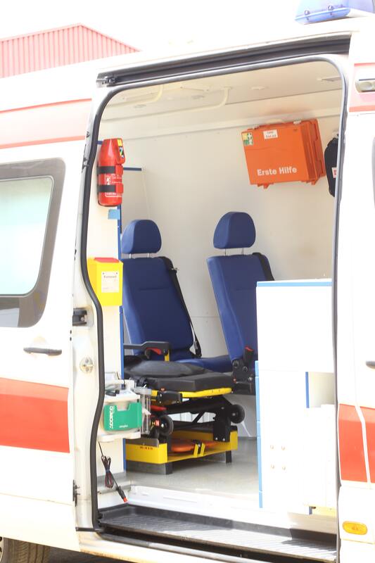 The inside of an ambulance with the door open.