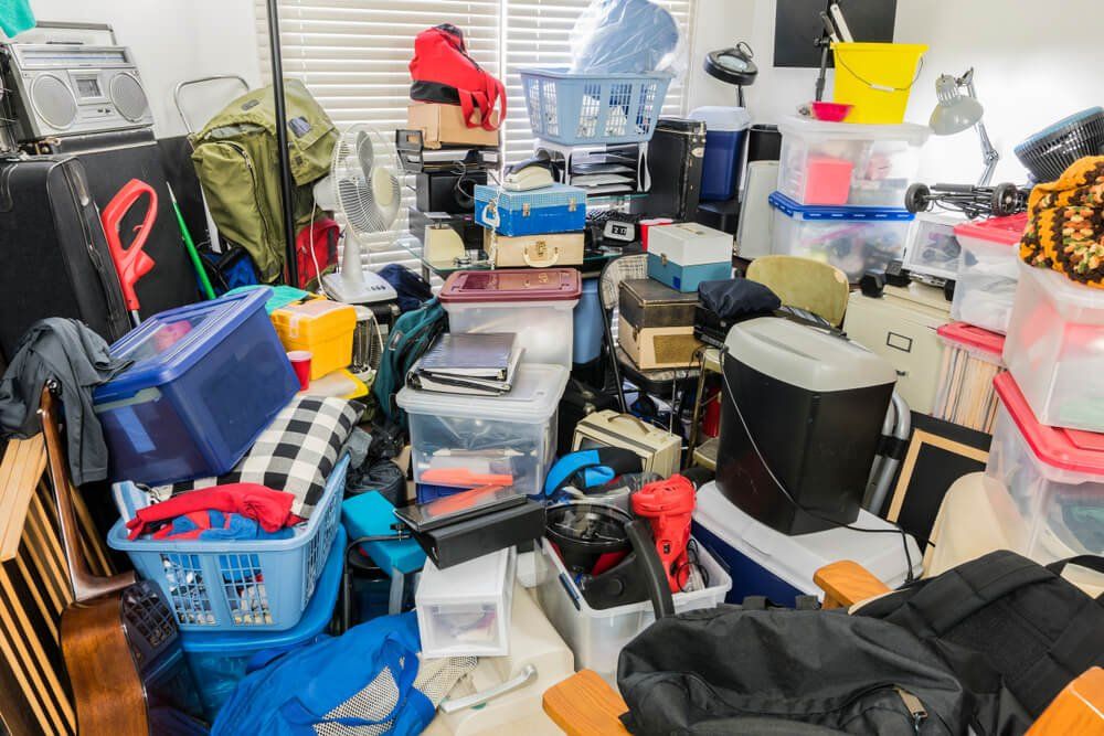 A room filled with lots of boxes , baskets , and other items.