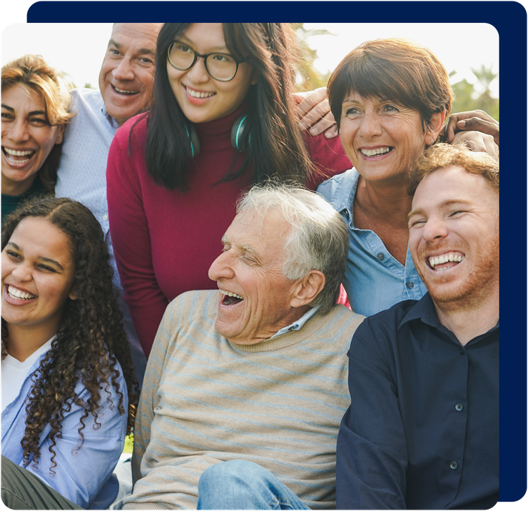 Group of diverse people smiling and laughing together outdoors.