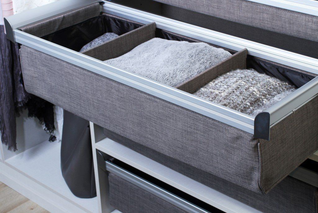 deep divided drawer holding sweaters