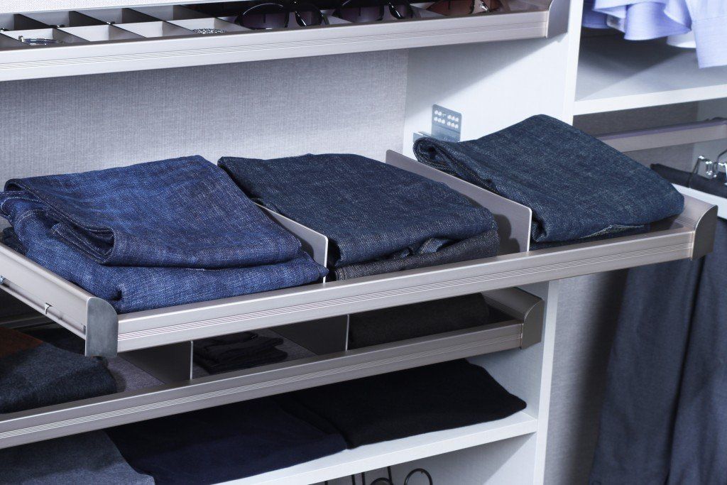 divided shelves holding jeans