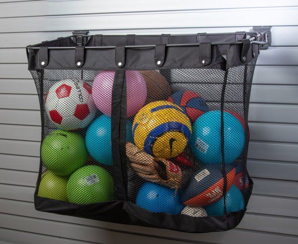 a mesh bag filled with balls including a nike volleyball