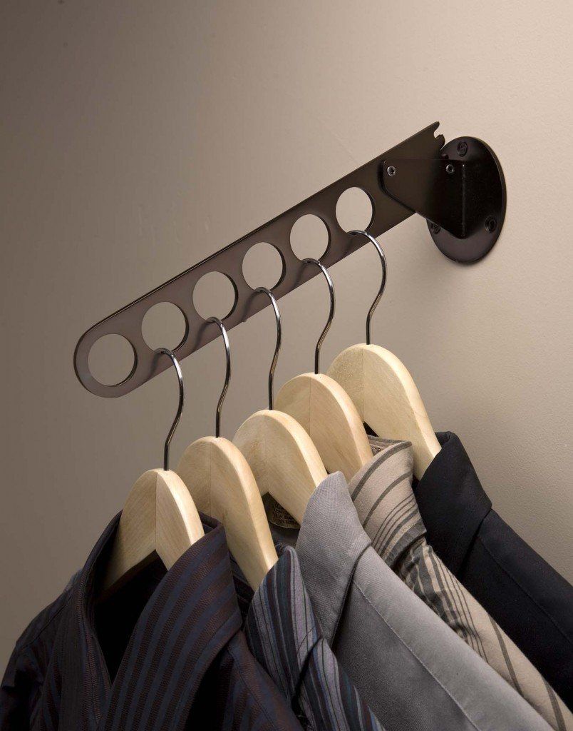 a row of shirts and ties hanging on a laundry valet rack