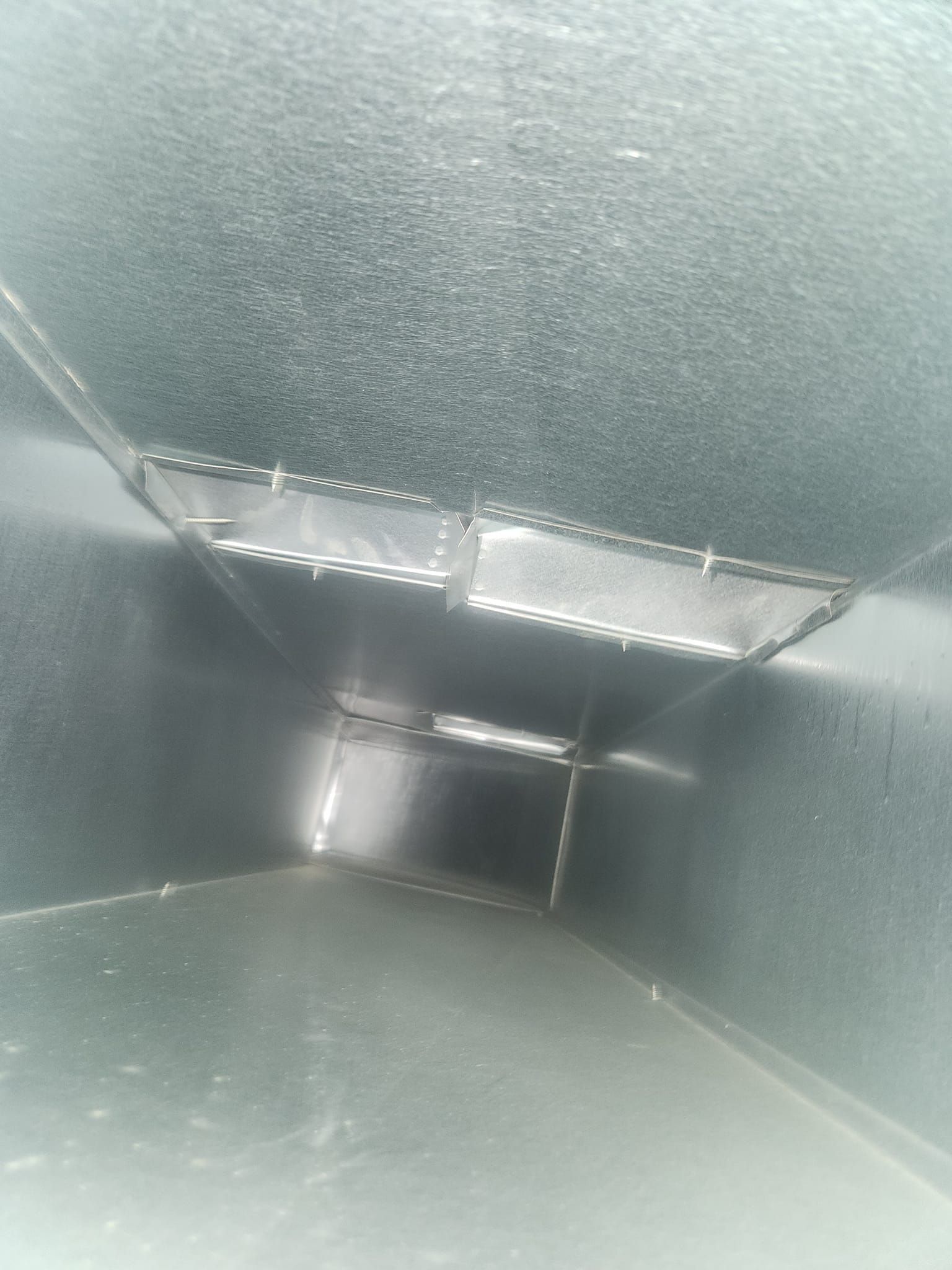 A close up of a metal pipe in a room